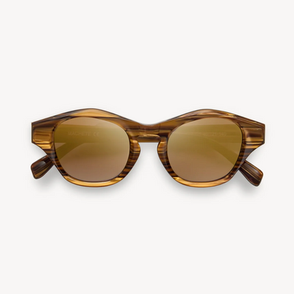 Lentes Olympia Ojos de Tigre con marcos redondeados de estilo artístico, elaborados artesanalmente con acetato italiano reciclable.