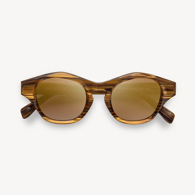 Lentes Olympia Ojos de Tigre con marcos redondeados de estilo artístico, elaborados artesanalmente con acetato italiano reciclable.