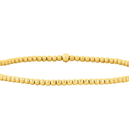 Pulsera de bolitas en oro 14K gold filled de 2 mm, con un brillo sutil que acompaña la muñeca con naturalidad.