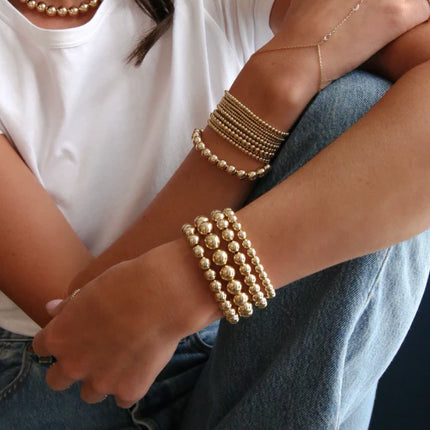 Pulsera artesanal 14K gold filled de 10 mm con ajuste elástico cómodo